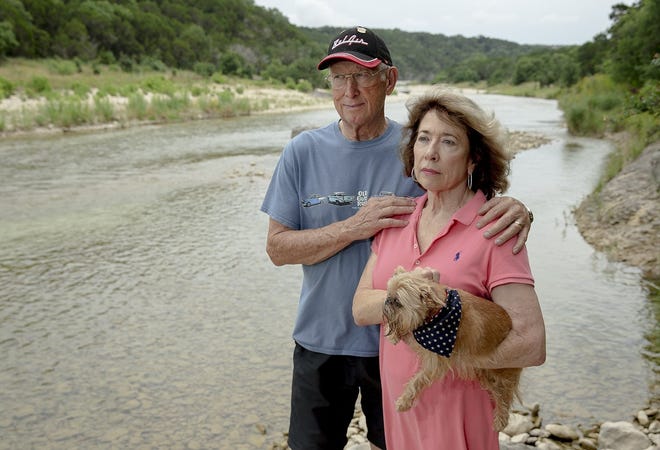 LuWann and Frank Tull, on a bank of the South San Gabriel River, are among area residents concerned about the water quality because of issues with the Liberty Hill wastewater treatment plant. [NICK WAGNER/AMERICAN-STATESMAN]