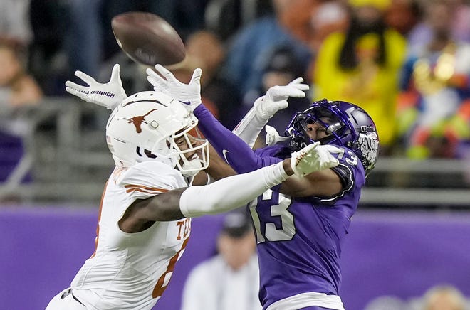 Texas cornerback Terrance Brooks breaks up a pass intended for TCU wide receiver Jaylon Robinson during their game last season. Brooks, a junior who started 13 games last season, is entering the transfer portal.