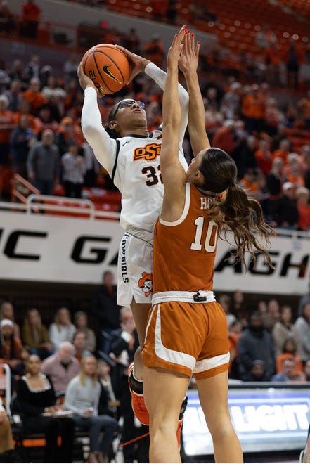 Jan 20, 2024; Stillwater, Okla, USA; Oklahoma State Cowgirls guard Stailee Heard (32) shoots over Texas Longhorns guard Shay Holle (10) in the first half of a womenÕs NCAA basketball game at Gallagher Iba Arena. Mandatory Credit: Mitch Alcala-The Oklahoman. Mandatory Credit: Mitch Alcala-The Oklahoman