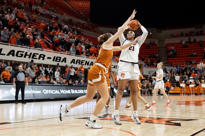 Jan 20, 2024; Stillwater, Okla, USA; Oklahoma State Cowgirls center Hannah Gusters (21) shoots over Texas Longhorns forward Taylor Jones (44) in the first half of a womenÕs NCAA basketball game at Gallagher Iba Arena. Mandatory Credit: Mitch Alcala-The Oklahoman. Mandatory Credit: Mitch Alcala-The Oklahoman