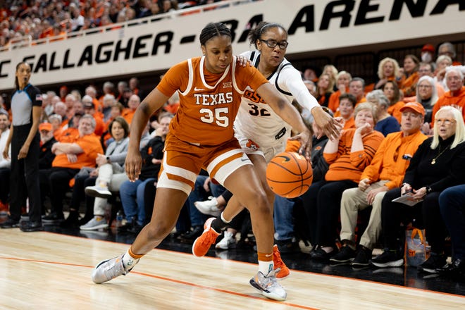 Jan 20, 2024; Stillwater, Okla, USA; Texas Longhorns forward Madison Booker (35) and Oklahoma State Cowgirls guard Stailee Heard (32) fight for a loose ball in the first half of a womenÕs NCAA basketball game at Gallagher Iba Arena. Mandatory Credit: Mitch Alcala-The Oklahoman. Mandatory Credit: Mitch Alcala-The Oklahoman