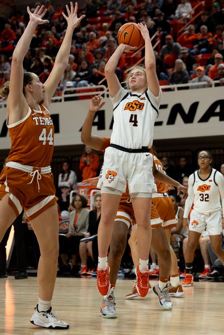 Jan 20, 2024; Stillwater, Okla, USA; Oklahoma State Cowgirls guard Anna Gret Asi (4) shoots over Texas Longhorns forward Taylor Jones (44) in the second half of a womenÕs NCAA basketball game at Gallagher Iba Arena. Mandatory Credit: Mitch Alcala-The Oklahoman. Mandatory Credit: Mitch Alcala-The Oklahoman