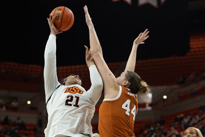 Jan 20, 2024; Stillwater, Okla, USA; Oklahoma State Cowgirls center Hannah Gusters (21) shoots the ball over Texas Longhorns forward Taylor Jones (44) in the second half of a womenÕs NCAA basketball game at Gallagher Iba Arena. Mandatory Credit: Mitch Alcala-The Oklahoman. Mandatory Credit: Mitch Alcala-The Oklahoman
