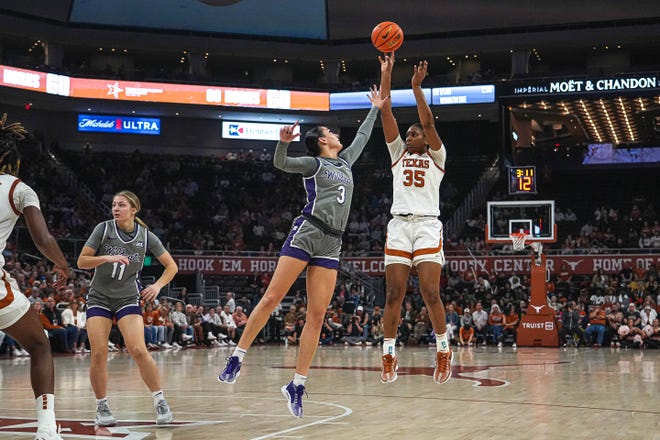Texas Longhorns guard Madison Booker (35) shoots over Kansas State guard Jaelyn Glenn (3) during the basketball game at the Moody Center on Sunday, Feb. 4, 2024 in Austin.