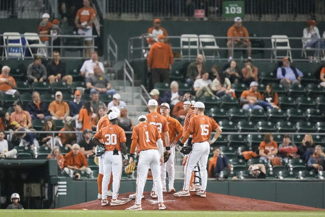 Texas players gather on the mound during a Feb. 20 game against Houston Christian. On Thursday, the Longhorns were blasted 14-6 by No. 23 Kansas State in the first game of their Big 12 series in Manhattan, Kan.