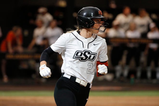 Oklahoma State outfielder Haidyn Sokoloski (21) hits a home run to run rule South Dakota State in the sixth inning of a college softball game between the Oklahoma State University Cowgirls and the South Dakota State Jackrabbits, Tuesday, Feb. 27, 2024.