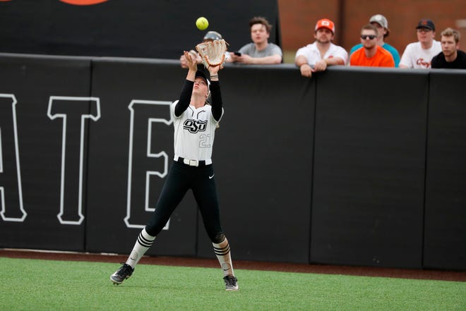 Oklahoma State outfielder Haidyn Sokoloski (21) catches the ball for an out during a college softball game between the Oklahoma State University Cowgirls and the South Dakota State Jackrabbits, Tuesday, Feb. 27, 2024.