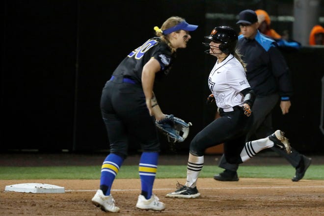 Oklahoma State catcher Caroline Wang (66) runs to third in the second softball game of a double header between the Oklahoma State University Cowgirls and the South Dakota State Jackrabbits, Tuesday, Feb. 27, 2024.
