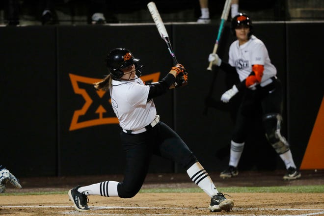 Oklahoma State catcher Caroline Wang (66) hits a single in the second softball game of a double header between the Oklahoma State University Cowgirls and the South Dakota State Jackrabbits, Tuesday, Feb. 27, 2024.