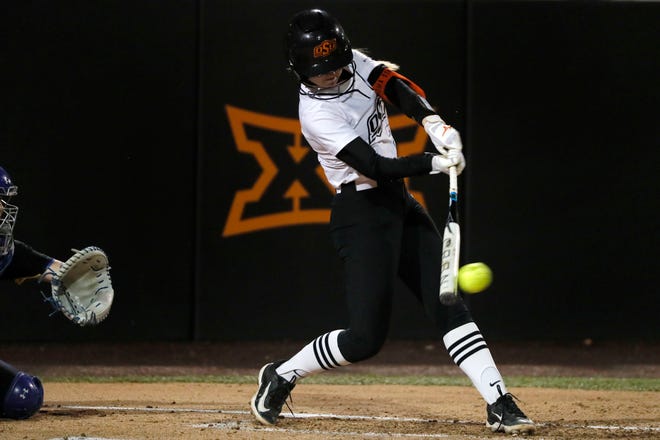 Oklahoma State infielder Rosie Davis (26) gets a hit in the second softball game of a double header between the Oklahoma State University Cowgirls and the South Dakota State Jackrabbits, Tuesday, Feb. 27, 2024.