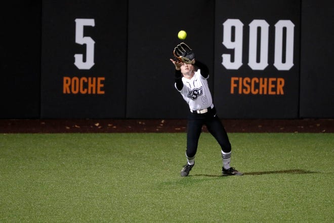 Oklahoma State outfielder Tia Warsop (9) catches the ball for an out pitches in the second softball game of a double header between the Oklahoma State University Cowgirls and the South Dakota State Jackrabbits, Tuesday, Feb. 27, 2024.