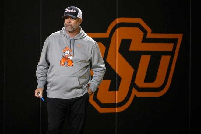 Oklahoma State coach Kenny Gajewski stands in the second softball game of a double header between the Oklahoma State University Cowgirls and the South Dakota State Jackrabbits, Tuesday, Feb. 27, 2024.