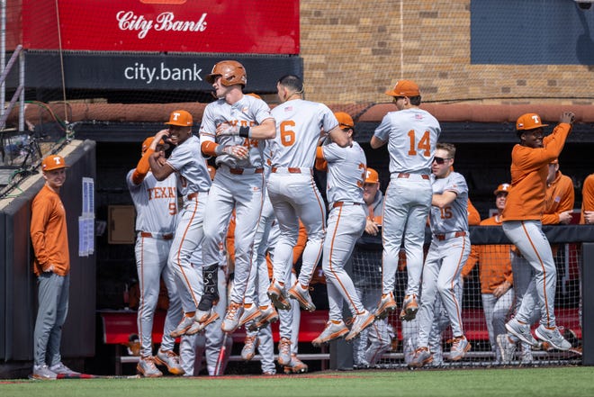 Texas outfielder Max Belyeu, center, celebrates a home run with Longhorns' dugout during a March 9 game at Texas Tech. Belyeu had a huge game in Texas' 11-1 win over Baylor on Sunday, tying a school record with three home runs, including a grand slam and six RBIs.