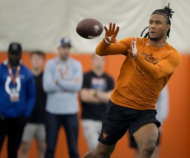 Wide receiver Adonai Mitchell goes through drills at Texas' Pro Day at Frank Denius Fields in March. Mitchell didn't get picked in the first round of the NFL draft but enters Friday's second round as the top-rated receiver on the draft board.