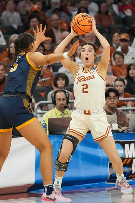 Texas Longhorns guard Shaylee Gonzales (2) handles the ball as she looks to pass to a teammate as Texas takes on the Drexel Dragons in round one of the NCAA women's basketball tournament at the Moody Center in Austin Friday, March 22, 2024.