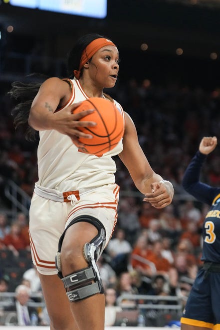 Texas Longhorns forward Aaliyah Moore (23) swats at the ball to keep it inbound as Texas takes on the Drexel Dragons in round one of the NCAA women's basketball tournament at the Moody Center in Austin Friday, March 22, 2024.