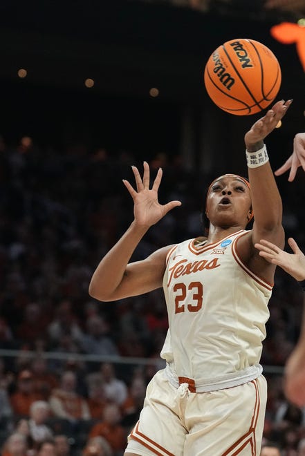 Texas Longhorns forward Aaliyah Moore (23) reaches for the ball as Texas takes on the Drexel Dragons in round one of the NCAA women's basketball tournament at the Moody Center in Austin Friday, March 22, 2024.