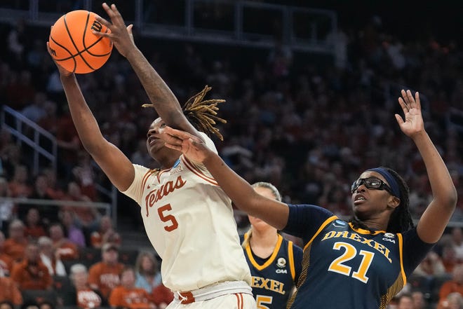 Texas Longhorns forward DeYona Gaston (5) and Drexel Dragons forward Jasmine Valentine (21) reach for the ball as Texas takes on the Drexel Dragons in round one of the NCAA women's basketball tournament at the Moody Center in Austin Friday, March 22, 2024.