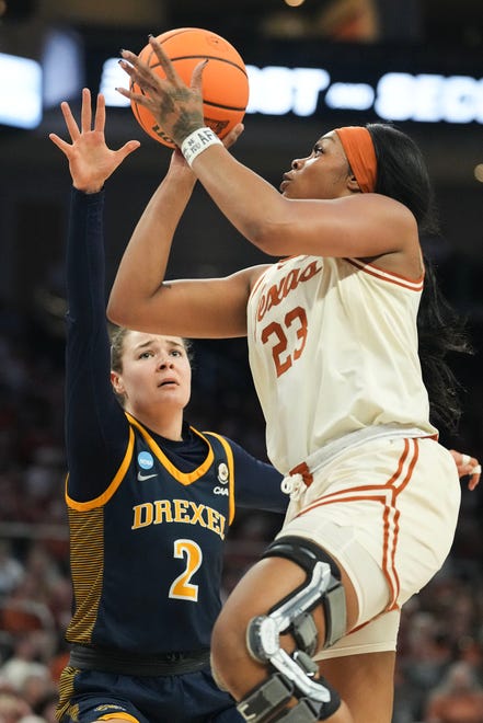 Texas Longhorns forward Aaliyah Moore (23) shoots the ball as Texas takes on the Drexel Dragons in round one of the NCAA women's basketball tournament at the Moody Center in Austin Friday, March 22, 2024.