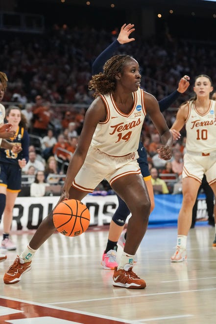 Texas Longhorns forward Amina Muhammad (14) dribbles the ball as Texas takes on the Drexel Dragons in round one of the NCAA women's basketball tournament at the Moody Center in Austin Friday, March 22, 2024.