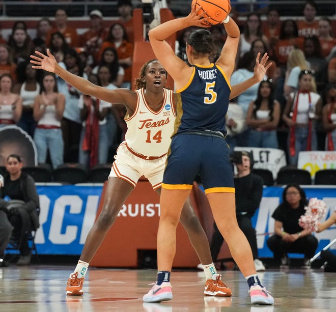 Texas Longhorns forward Amina Muhammad (14) guards Drexel Dragons forward Chloe Hodges (5) as Texas takes on the Drexel Dragons in round one of the NCAA women's basketball tournament at the Moody Center in Austin Friday, March 22, 2024.