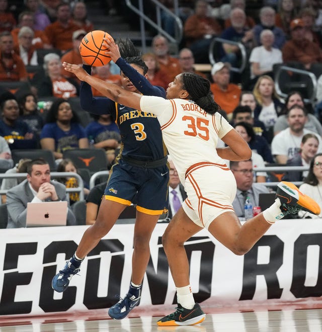 Texas Longhorns forward Madison Booker (35) guards Drexel Dragons guard Amaris Baker (3) as Texas takes on the Drexel Dragons in round one of the NCAA women's basketball tournament at the Moody Center in Austin Friday, March 22, 2024.