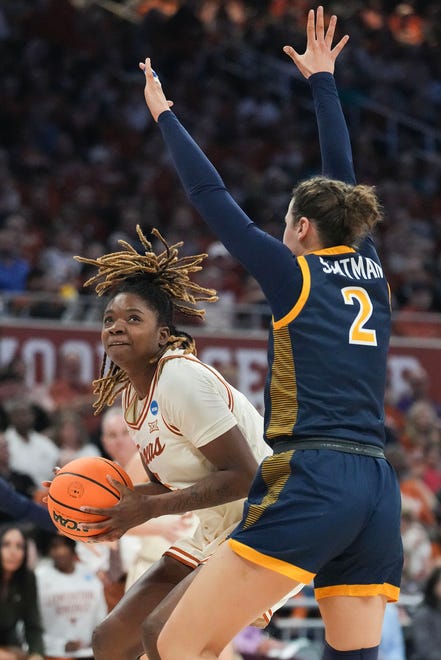 Texas Longhorns forward DeYona Gaston (5) looks to pass to a teammate as Drexel Dragons forward Hetta Saatman (2) guards as Texas takes on the Drexel Dragons in round one of the NCAA women's basketball tournament at the Moody Center in Austin Friday, March 22, 2024.
