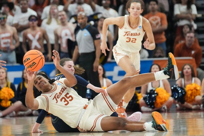 Texas Longhorns forward Madison Booker (35) fights for the ball as Texas takes on the Drexel Dragons in round one of the NCAA women's basketball tournament at the Moody Center in Austin Friday, March 22, 2024.