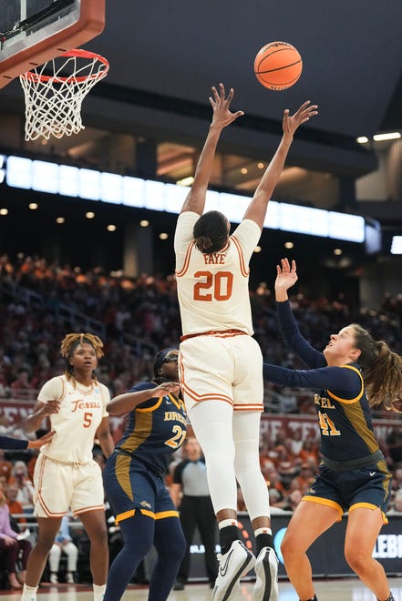 Texas Longhorns forward Khadija Faye (20) reaches for the ball as Texas takes on the Drexel Dragons in round one of the NCAA women's basketball tournament at the Moody Center in Austin Friday, March 22, 2024.