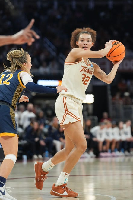 Texas Longhorns guard Ndjakalenga Mwenentanda (32) looks to pass to a teammate as Texas takes on the Drexel Dragons in round one of the NCAA women's basketball tournament at the Moody Center in Austin Friday, March 22, 2024.
