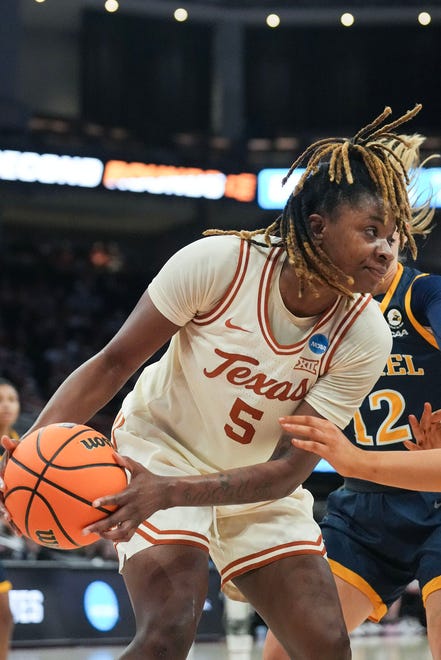 Texas Longhorns forward DeYona Gaston (5) handles the ball as Texas takes on the Drexel Dragons in round one of the NCAA women's basketball tournament at the Moody Center in Austin Friday, March 22, 2024.