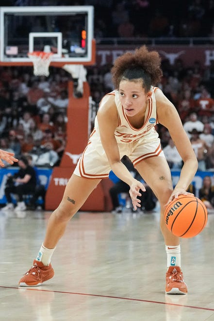 Texas Longhorns guard Ndjakalenga Mwenentanda (32) looks to pass to a teammate as Texas takes on the Drexel Dragons in round one of the NCAA women's basketball tournament at the Moody Center in Austin Friday, March 22, 2024.