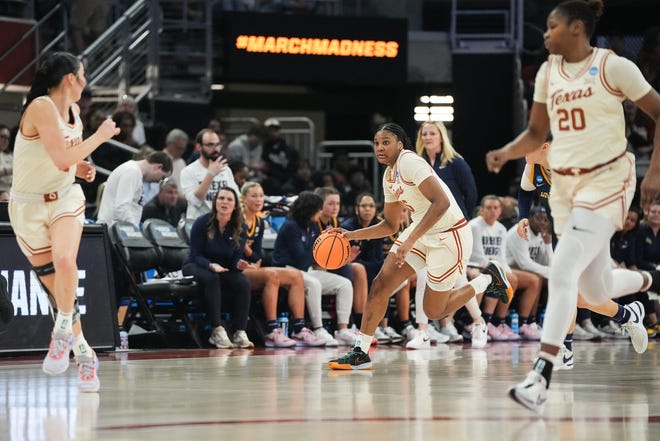 Texas Longhorns forward Madison Booker (35) dribbles down the court as Texas takes on the Drexel Dragons in round one of the NCAA women's basketball tournament at the Moody Center in Austin Friday, March 22, 2024.