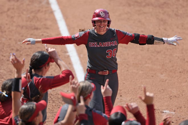 Oklahoma's Riley Ludlam (30) celebrates hitting a two-run home run in the fifth inning of a college softball game between the University of Oklahoma Sooners (OU) and the Baylor Bears in Norman, Okla., Saturday, March 23, 2024.