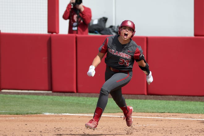 Oklahoma's Alyssa Brito (33) celebrates after hitting a home run in the third inning a college softball game between the University of Oklahoma Sooners (OU) and the Baylor Bears in Norman, Okla., Saturday, March 23, 2024.