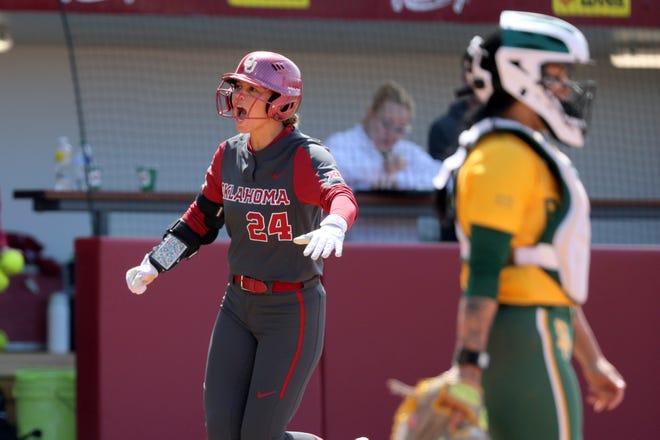 Oklahoma's Jayda Coleman (24) celebrates after hitting a home run in the second inning of a college softball game between the University of Oklahoma Sooners (OU) and the Baylor Bears in Norman, Okla., Saturday, March 23, 2024.