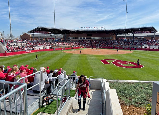 Fans watch during a college softball game between the University of Oklahoma Sooners (OU) and the Baylor Bears in Norman, Okla., Saturday, March 23, 2024.