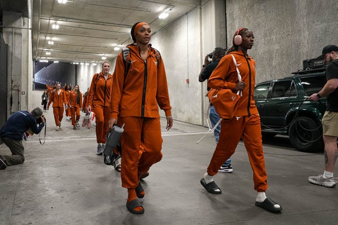 Aaliyah Moore and Amina Muhammad lead the Texas Longhorns arrive at the Moody Center for the NCAA playoff game against Alabama on Sunday, Mar. 23, 2024 in Austin.