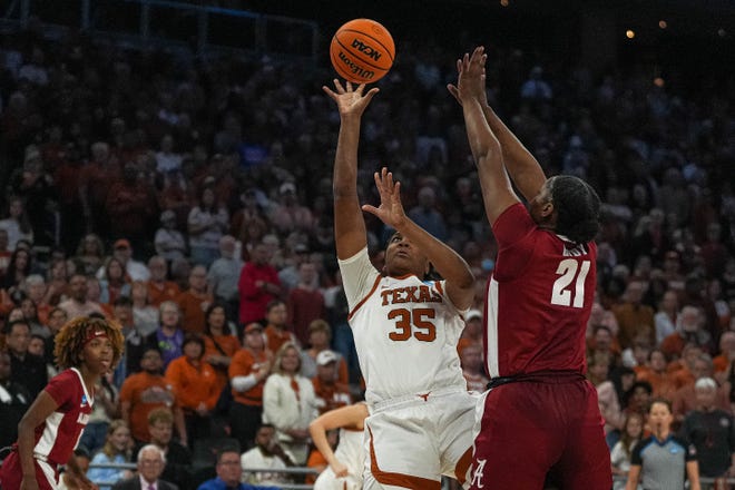 Texas Longhorns forward Madison Booker (35) shoots over Alabama forward Essence Cody (21) during the NCAA playoff game at the Moody Center on Sunday, Mar. 23, 2024 in Austin.