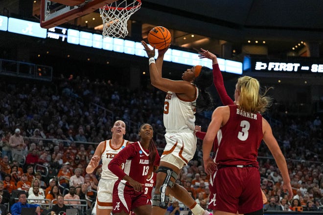 Texas Longhorns forward Aaliyah Moore (23) shoots the ball during the NCAA playoff game against Alabama at the Moody Center on Sunday, Mar. 23, 2024 in Austin.