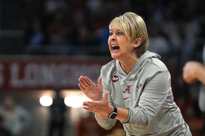 Alabama head coach Kristy Curry yells instructions from the sideline during the NCAA playoff game against the Texas Longhorns at the Moody Center on Sunday, Mar. 23, 2024 in Austin.
