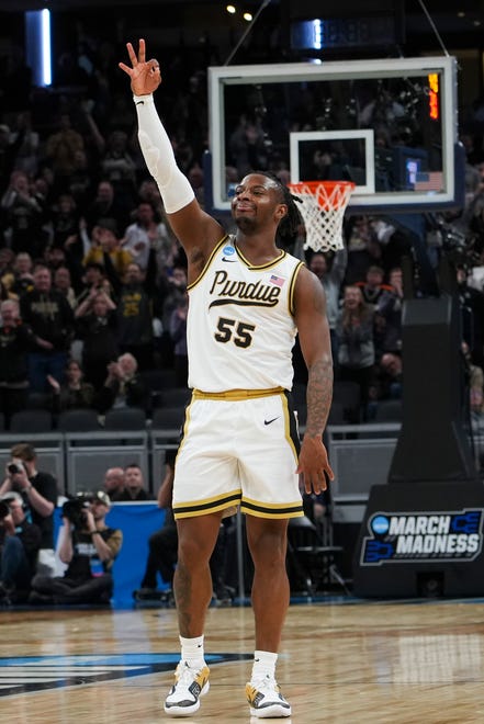 Purdue Boilermakers guard Lance Jones (55) celebrates a three-pointer, Sunday, March 24, 2024, during the second round of the NCAA Men’s Basketball Tournament at Gainbridge Fieldhouse in Indianapolis. The Purdue Boilermakers are leading the Utah State Aggies at halftime 49-33.