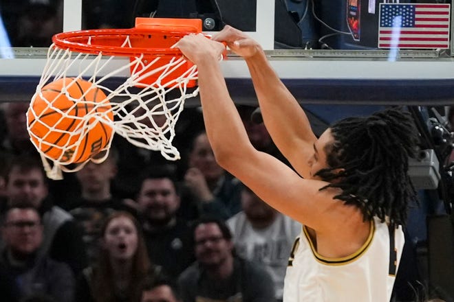 Purdue Boilermakers forward Trey Kaufman-Renn (4) dunks the ball against Utah State Aggies on Sunday, March 24, 2024, during the second round of the NCAA Men’s Basketball Tournament at Gainbridge Fieldhouse in Indianapolis. The Purdue Boilermakers defeated the Utah State Aggies 106-67.