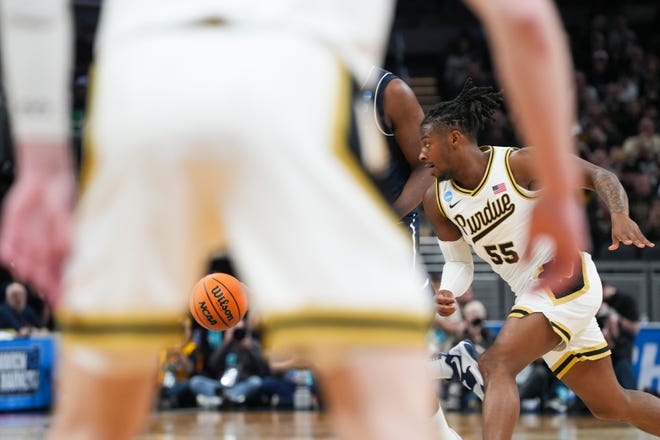 Purdue Boilermakers guard Lance Jones (55) runs after the ball while playing defense, Sunday, March 24, 2024, during the second round of the NCAA Men’s Basketball Tournament at Gainbridge Fieldhouse in Indianapolis. The Purdue Boilermakers defeated the Utah State Aggies 106-67.