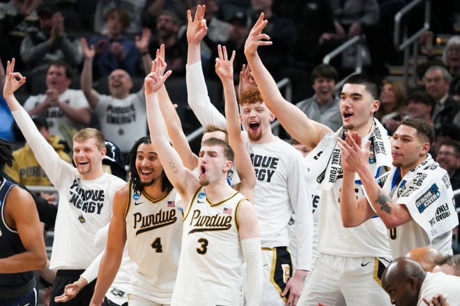 Purdue Boilermakers celebrate after scoring, Sunday, March 24, 2024, during the second round of the NCAA Men’s Basketball Tournament at Gainbridge Fieldhouse in Indianapolis. The Purdue Boilermakers defeated the Utah State Aggies 106-67.