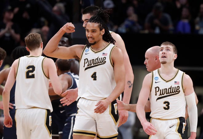 Purdue Boilermakers forward Trey Kaufman-Renn (4) reacts after scoring during NCAA Men’s Basketball Tournament game against the Utah State Aggies, Sunday, March 24, 2024, at Gainbridge Fieldhouse in Indianapolis.