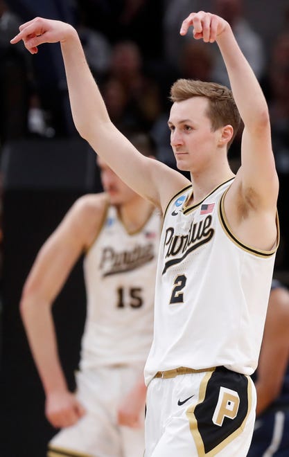 Purdue Boilermakers guard Fletcher Loyer (2) reacts after Purdue Boilermakers center Zach Edey (15) scores during NCAA Men’s Basketball Tournament game against the Utah State Aggies, Sunday, March 24, 2024, at Gainbridge Fieldhouse in Indianapolis.