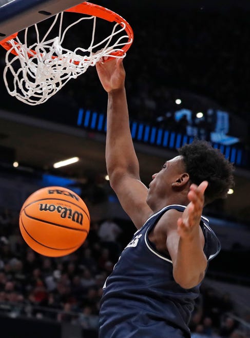 Utah State Aggies forward Great Osobor (1) dunks the ball during NCAA Men’s Basketball Tournament game against the Purdue Boilermakers, Sunday, March 24, 2024, at Gainbridge Fieldhouse in Indianapolis.