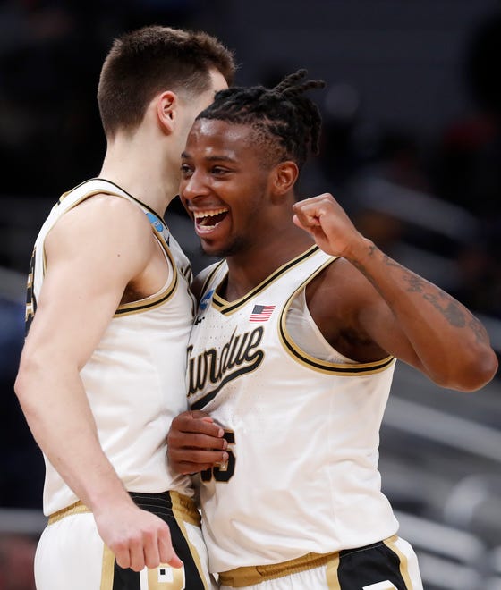 Purdue Boilermakers forward Camden Heide (23) and Purdue Boilermakers guard Lance Jones (55) celebrate during NCAA Men’s Basketball Tournament game against the Utah State Aggies, Sunday, March 24, 2024, at Gainbridge Fieldhouse in Indianapolis.