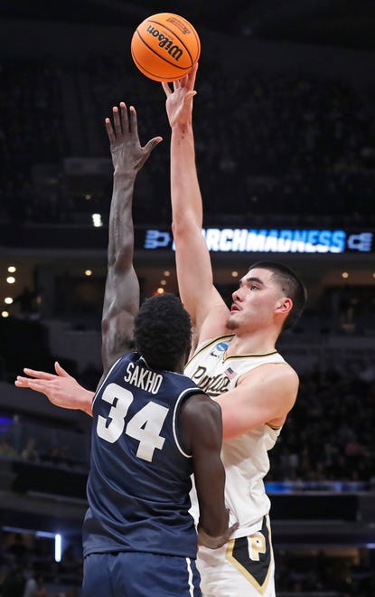 Utah State Aggies forward Kalifa Sakho (34) defends the shot of Purdue Boilermakers center Zach Edey (15) during NCAA Men’s Basketball Tournament game, Sunday, March 24, 2024, at Gainbridge Fieldhouse in Indianapolis. Purdue Boilermakers won 106-67.